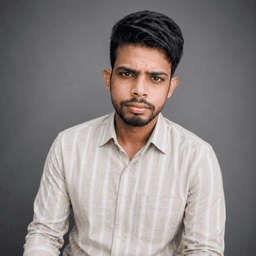 A portrait of Rahul smiling.